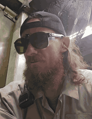 Andy on the floor at Hitachi Astemo, safety glasses on