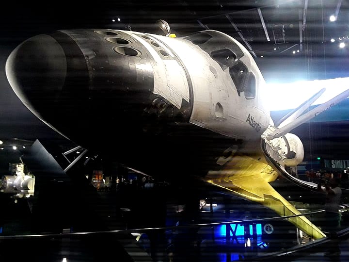The space shuttle Atlantis mounted at an angle in its exhibit hall