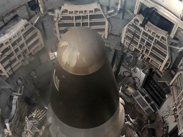 Looking down into the silo at the nose cone of a Titan II missile